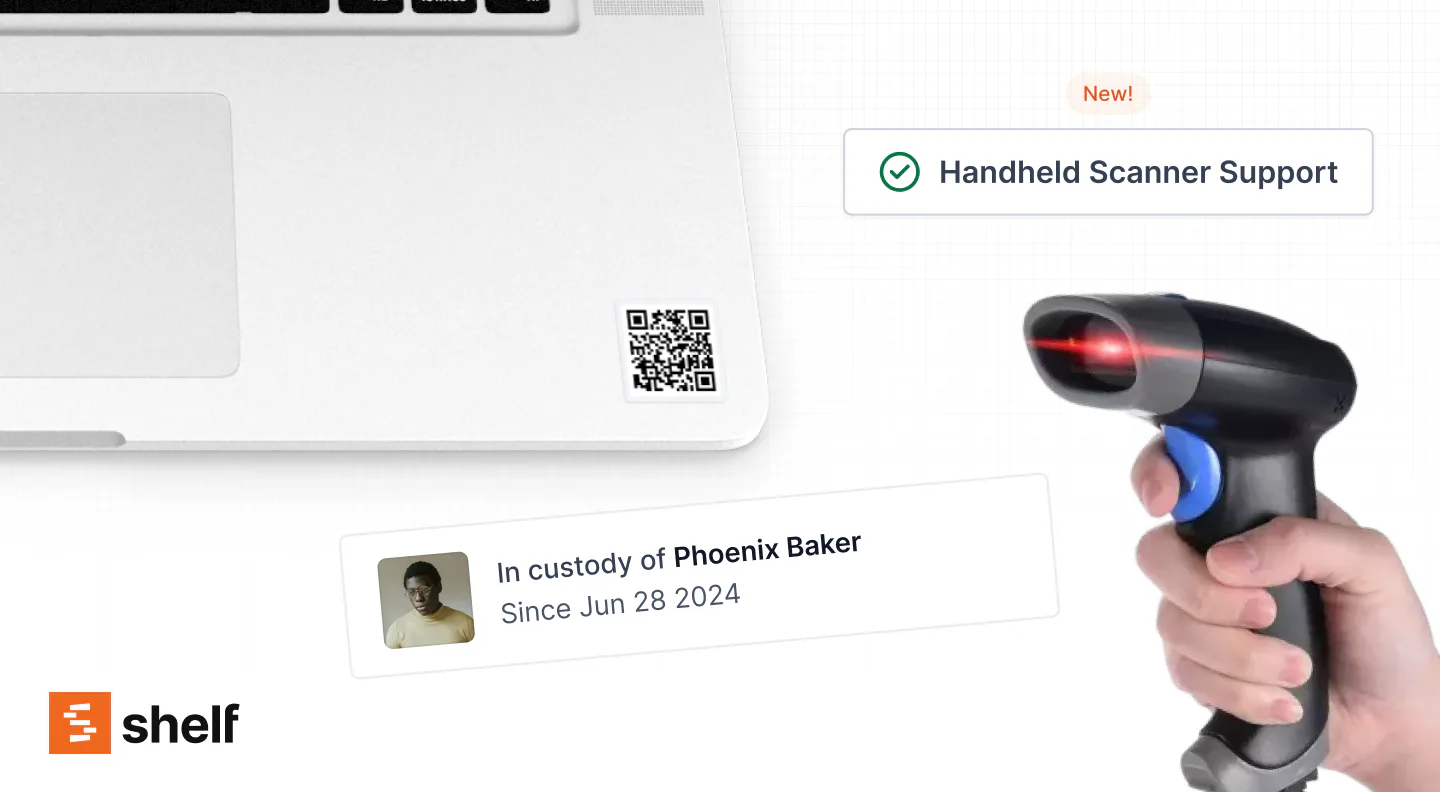 A handheld scanner reading a QR label on a laptop